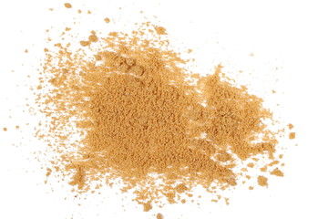 Unrefined light brown cane sugar pile isolated on white background, top view