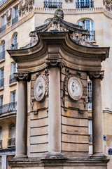 Monumental fountain (1900) occupies center square of Place Georges Mulot in Paris. It is decorated with 4 medallions representing Georges Mulot (engineer), Rosa Bonheur, Dr. Bouchut and Hauy Valentin.