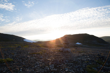 Cairn on Haltitunturi near Guolasjávri, sunbeam on the evening, summer 