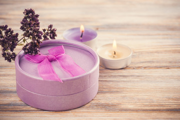 Fototapeta na wymiar Hand crafted purple gift with bow