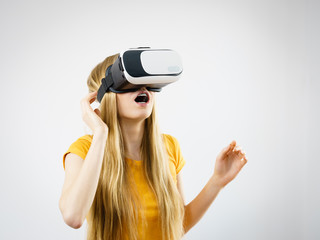 Girl wearing virtual reality goggles.