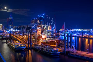 Hamburg, Panorama at night. With blue illuminated harbour © gerckens.photo