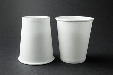 White paper cup for tea, coffee or juice. Space for text, mock up.