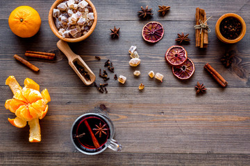 Merry christmas in winter evening with warm drink. Hot mulled wine or grog with fruits and spices...