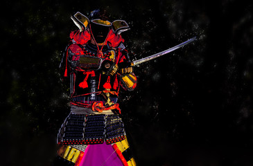 Samurai warrior with sword, isolated on the black background.