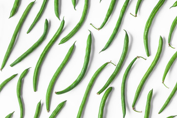 Green beans overhead closeup group isolated on white background in studio