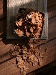 corn flakes placed on wooden mat