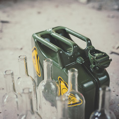 Terrorism. Molotov cocktail. Green military jerrycan with empty bottles