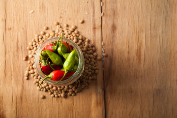 Raw lentils and rice with chilli pepper.