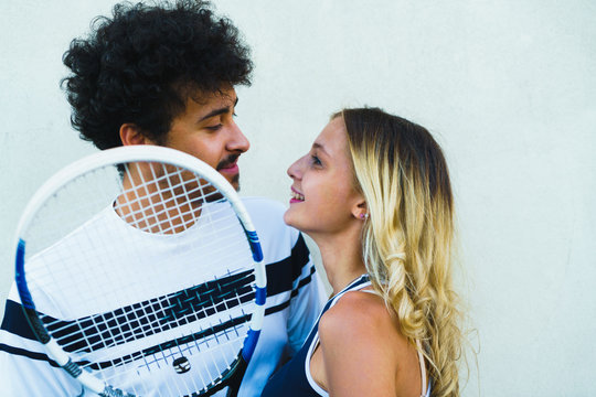 Couple posing with racket
