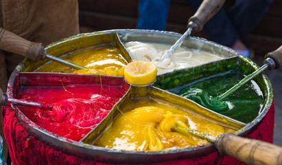 Bright caramel and ice-cream on the street market