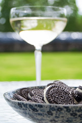 Oreo cookies and a glass of sparkling wine (champagne)
