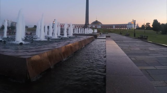 fountains in city park on a summer evening timelapse