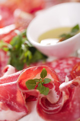 antipasti Platter of Cured Meat,   jamon, sausage, salame on white wood