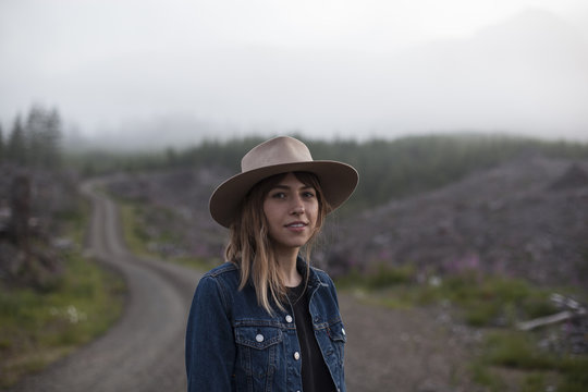 A Portrait Of A Beautiful Woman On A Gravel Road
