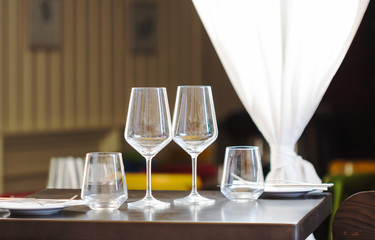 Empty water glasses,wine on table in restaurant.