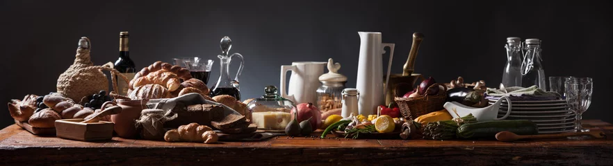 Foto op Plexiglas Rich food table, medieval style, panorama on rustic wood table and dark background. © Toomas Tikenberg