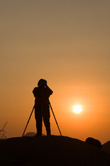 Photographer at sunset, Africa