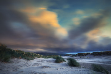Colorful Blurry Clouds over Hilly Beach of Barmouth in North Wales
