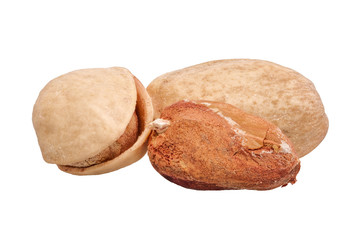 Salted pistachio nuts on a white background