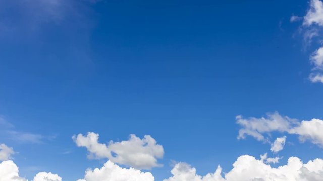 Time lapse clip of beautiful cloudscape white fluffy clouds over blue sky