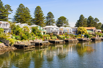 Piers and holiday houses along the Moyne River - Port Fairy, Victoria, Australia