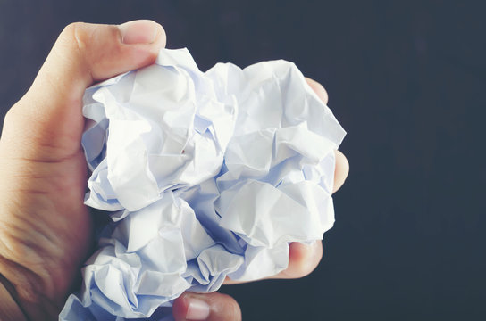 Crumpled Paper On Man Hand Isolated On Background