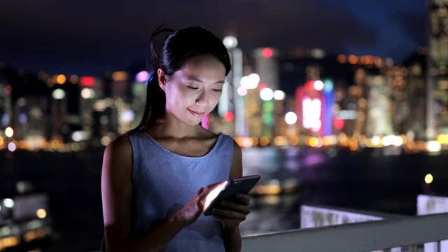 Chinese Woman use of cellphone in Hong Kong