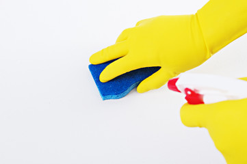 Person Cleaning with Rubber Gloves