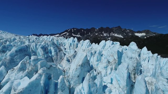 Arial 4k shots of a glacier and it's surroundings in Alaska