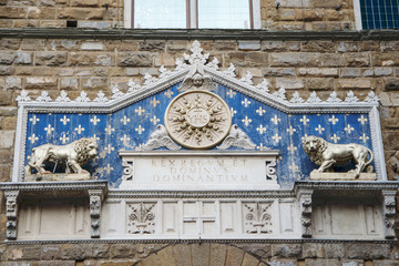 Details of the ornate facade at the main entrance of the Palazzo Vecchio in Florence