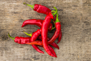 Red hot chili peppers on wooden table
