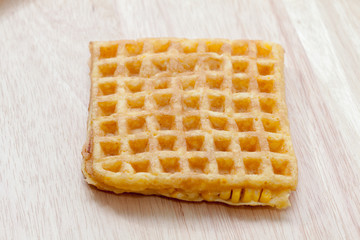 waffle with corn on wooden plate