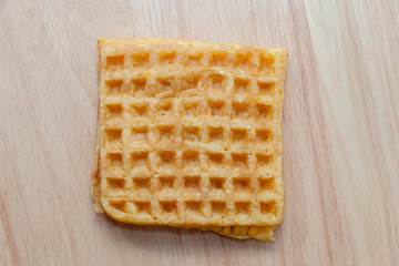 waffle with corn on wooden plate