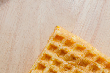 waffle with corn on wooden plate