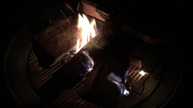 Campfire burning in fire pit at home