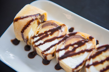 Homemade banana crepe cake with chocolate sauce