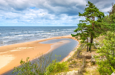 Fototapeta na wymiar Cloudy day at a shore of the Baltic Sea