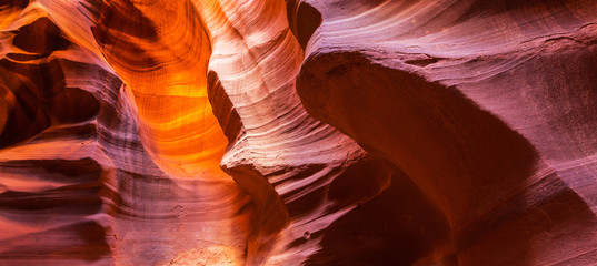 Beautiful, abstract, red rock shapes in Antelope Canyon, on a bright sunny day in summer © Calin Tatu