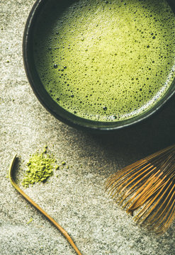 Flat-lay of freshly brewed Japanese matcha tea in Chasen bowl, top view