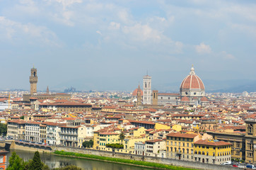 Fototapeta na wymiar Panoramic view to the river Arno, with Ponte Vecchio, Palazzo Vecchio and Cathedral of Santa Maria del Fiore (Duomo), Florence, Italy