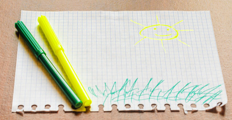 Children's picture with felt-tip pens, the sun. Two felt-tip pen
