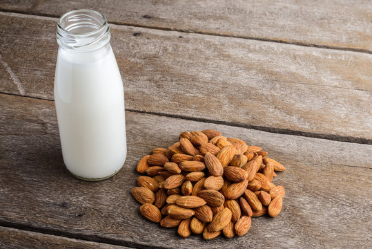almond milk in bottle with Almonds