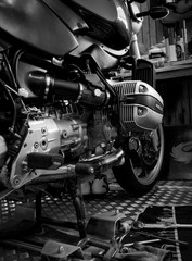 CHONBURI, THAILAND- SEPTEMBER 10, 2017 :Tool on the platform and single cylinder head cover in motorcycle shop,black and white scene, black and white image