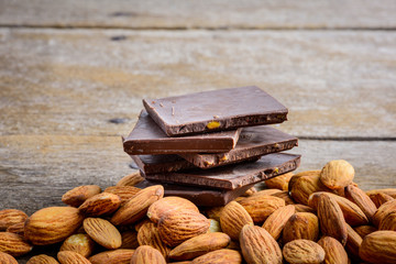 chocolate with almond on wooden