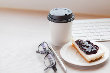 Disposable coffee cup with blueberry chess pie.