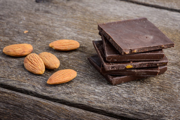 chocolate with almond on wooden