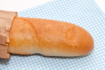 french bread with paper bag on white background