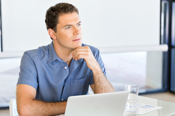 Pensive businessman at office