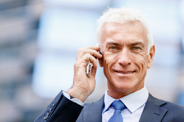 Portrait of confident businessman outdoors